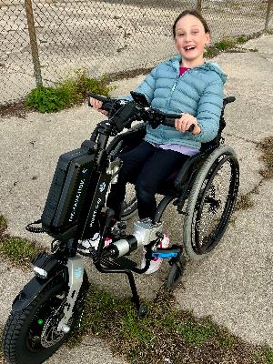 Claire rocking her PAWS (Power Assisted Wheelchair System)